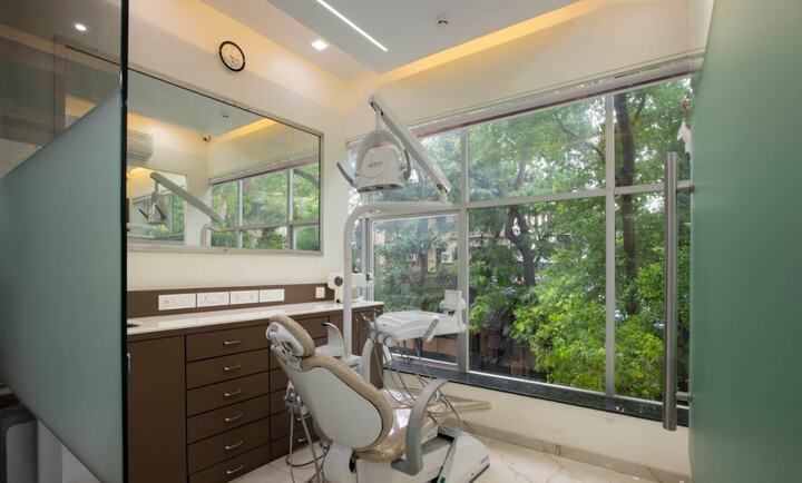 A treatment room with a large window, the chair turned towards the light
